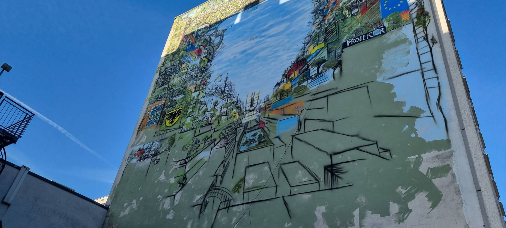 Hier entsteht ein riesiges Graffiti an der Hauswand des Gravis-Gebäudes auf der Kampstraße.